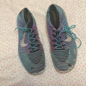 Blue and purple Nike athletic shoes.